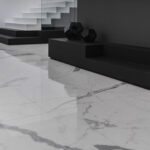 Room with marble-effect lapped porcelain stoneware flooring, black and white furnishings
