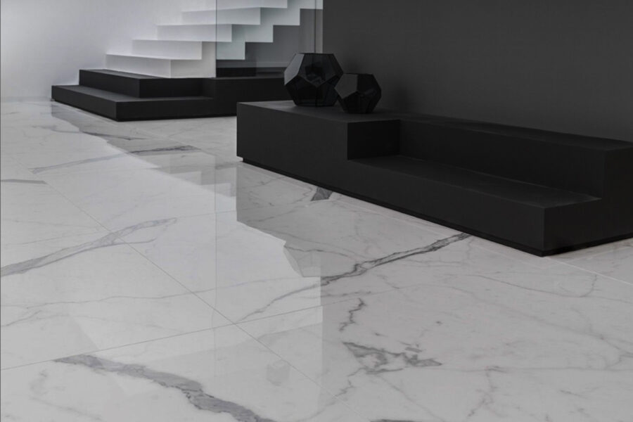 Room with marble-effect lapped porcelain stoneware flooring, black and white furnishings